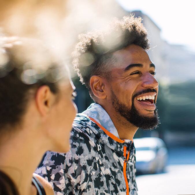 man smiling next to woman man smiling next to woman